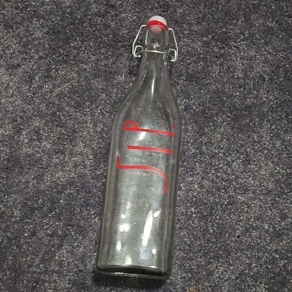 Rae Dunn Clear Glass Bottle with Red "Sip" Lettering